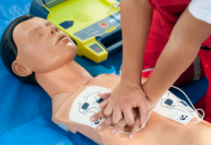 Person giving CPR to a dummy